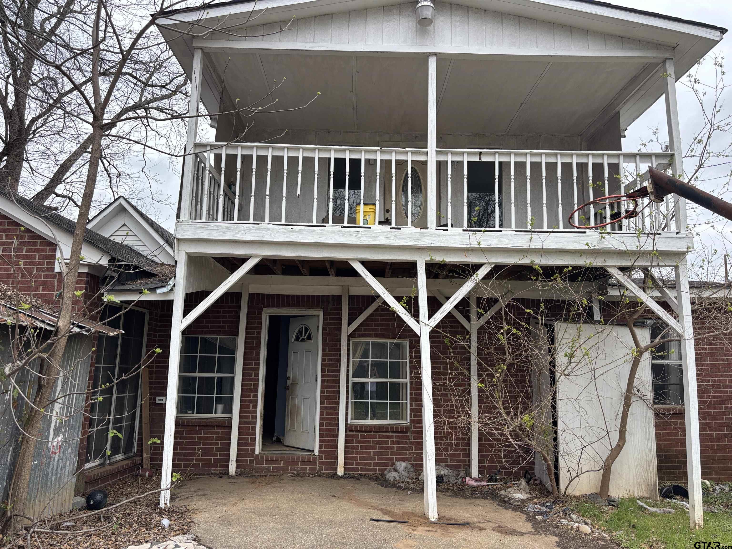 421 East Rosedale Street Tyler, TX 75702 - Photo 12 of 14 a view of a house with wooden deck