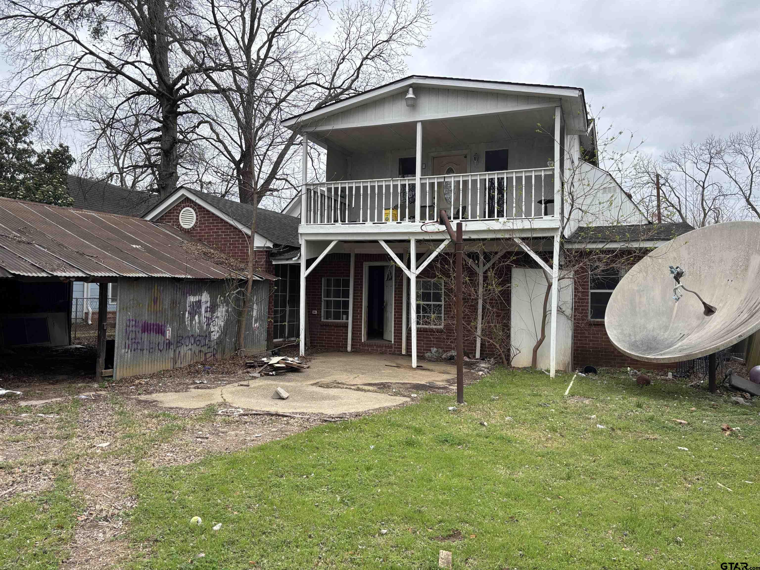 421 East Rosedale Street Tyler, TX 75702 - Photo 3 of 14 a view of a house with yard and a tree