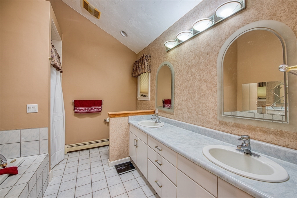 7 Tisdale Road Sharon, MA 02067 - Photo 18 of 37 a bathroom with a sink and a mirror