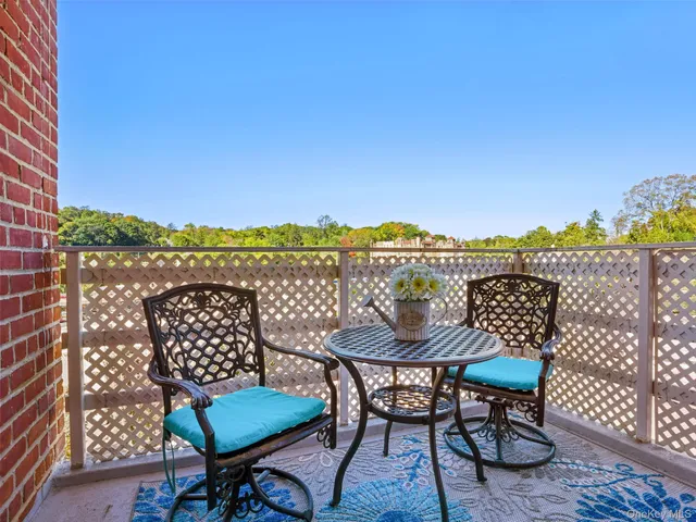 a view of a chairs and table on the terrace