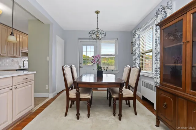 a view of a dining room with furniture window and outside view