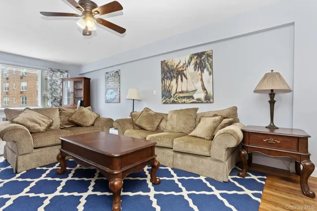 a living room with furniture and a rug