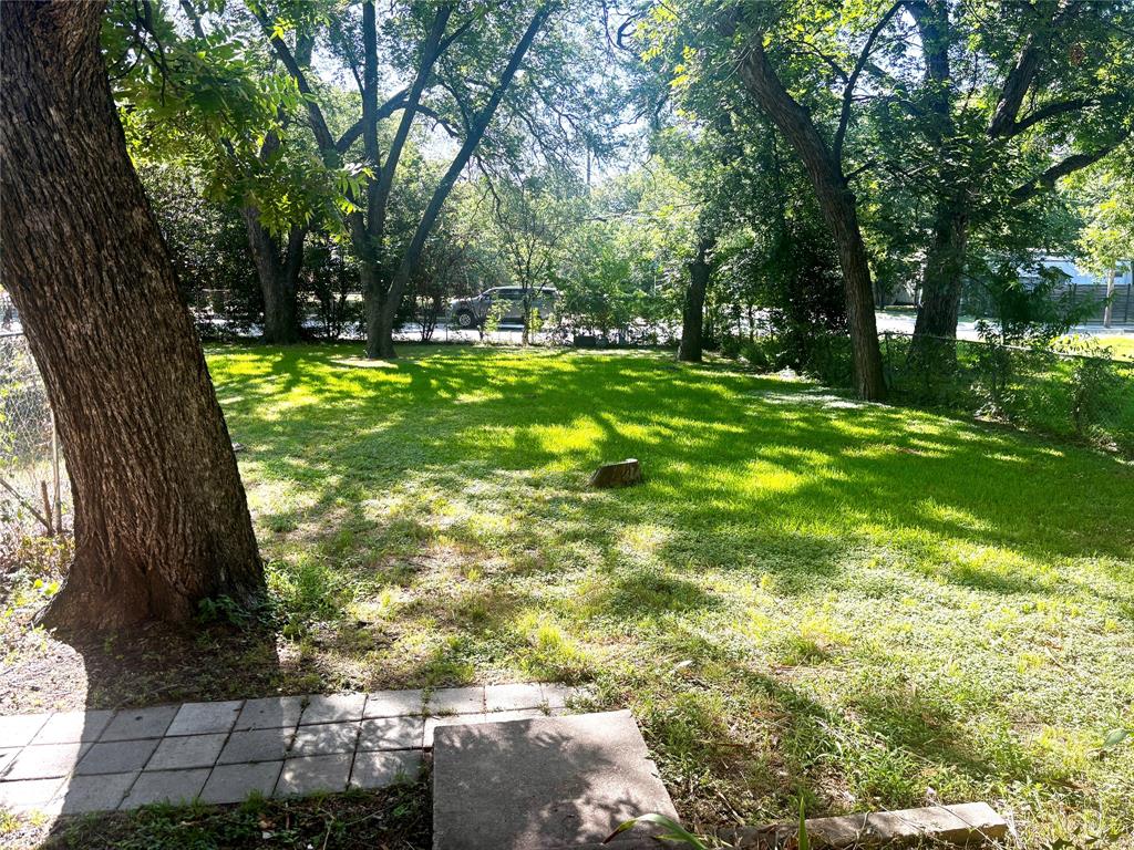 905 Isbell Road Fort Worth, TX 76114 - Photo 7 of 30 a view of yard with swimming pool and green space