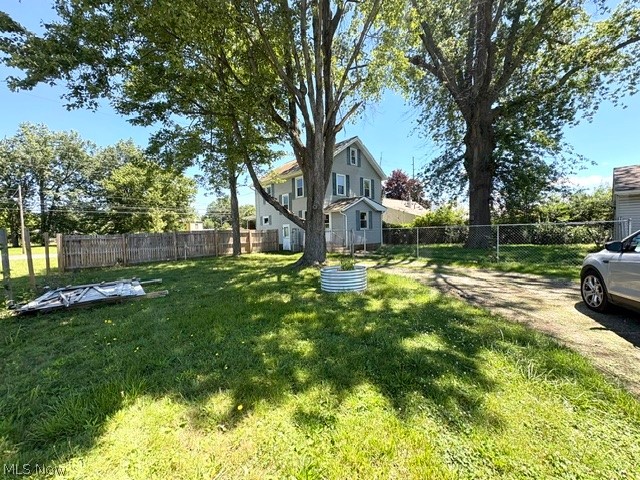 1919 Parkman Road Northwest Warren, OH 44485 - Photo 2 of 41 Back yard that had a privacy fence to the Driveway and behind the home is a chain link for pets or young children.