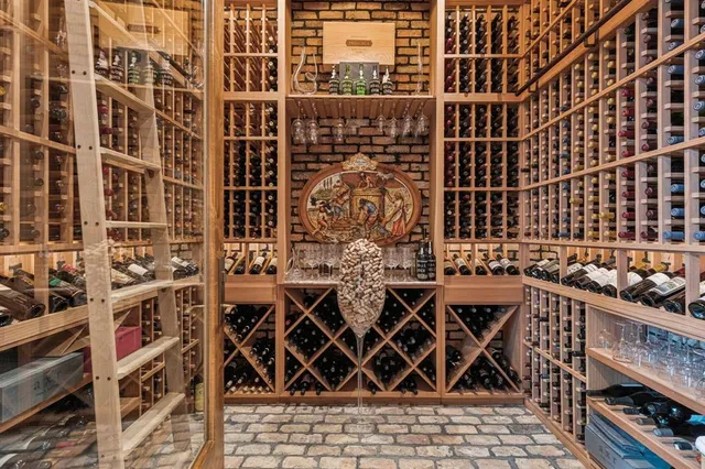 a living room with fireplace furniture and a floor to ceiling window