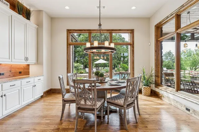 a living room with furniture fireplace and window