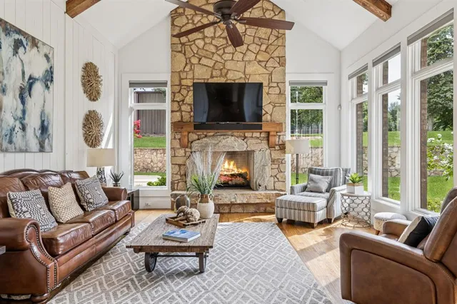 a bedroom with a bed and a large window with outer view