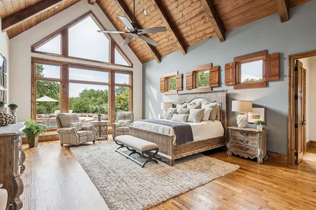 a spacious bathroom with a double vanity sink a mirror and a bathtub