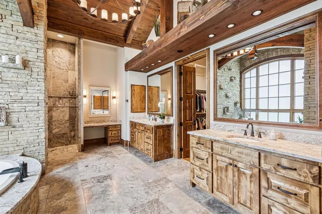 a bed room with a bed and a chandelier