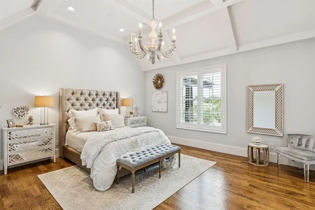 a bedroom with a large bed and a large window