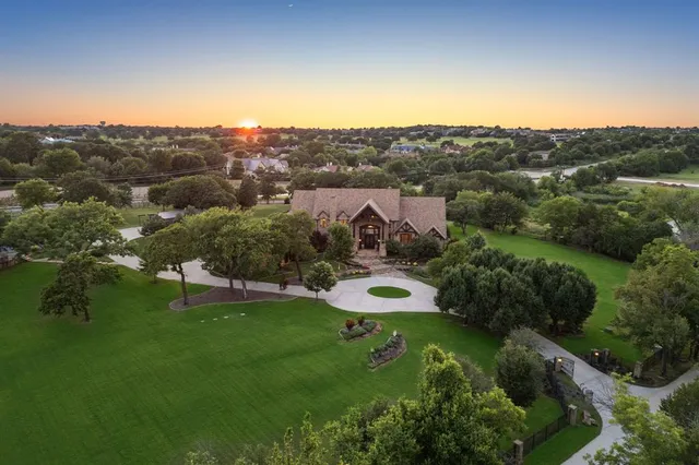 an aerial view of a house with mountain view