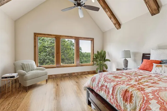 a balcony with furniture and a potted plant