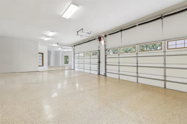 an aerial view of residential houses with outdoor space and street view