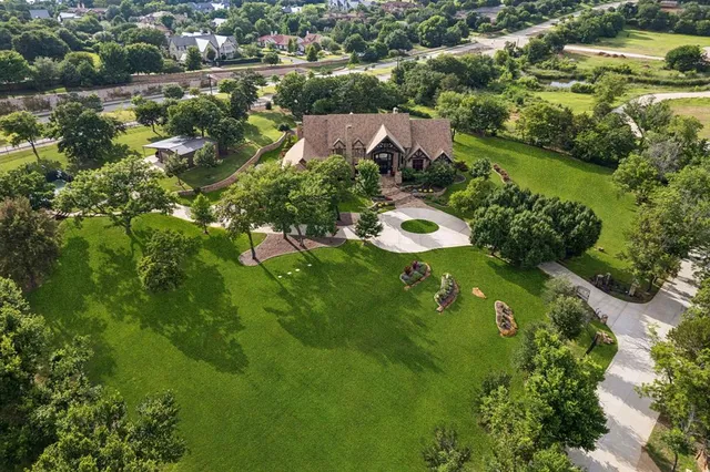an aerial view of a house with outdoor space and street view