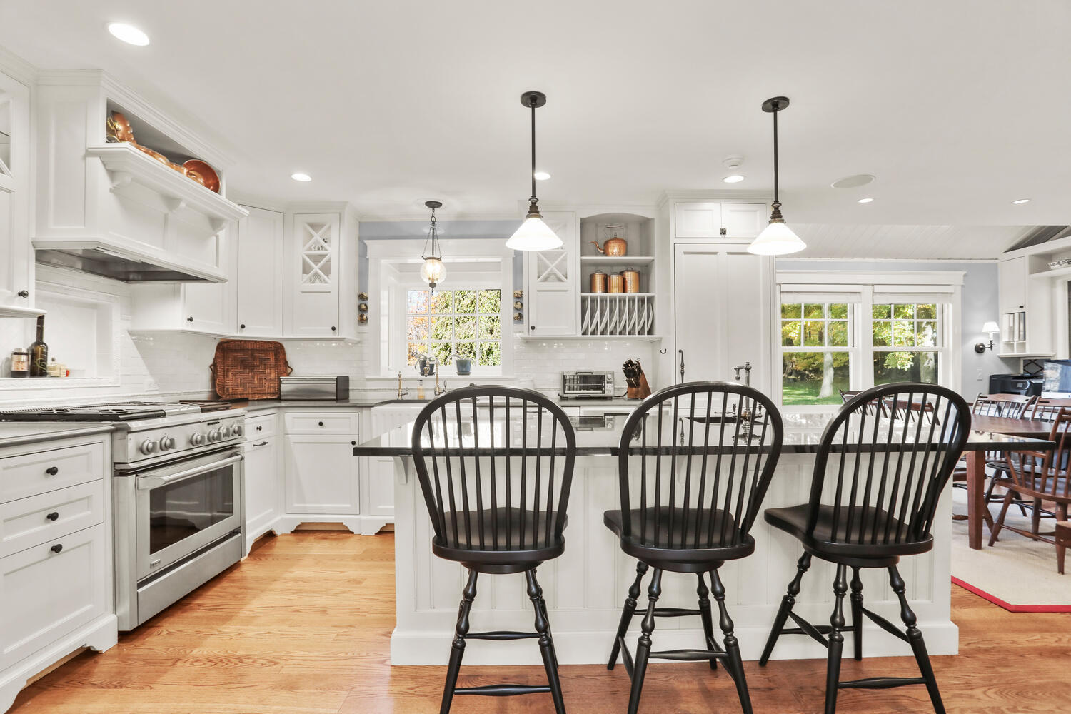 51 Logan Road New Canaan, CT 06840 - Photo 12 of 39 a view of a kitchen with furniture stove and wooden floor