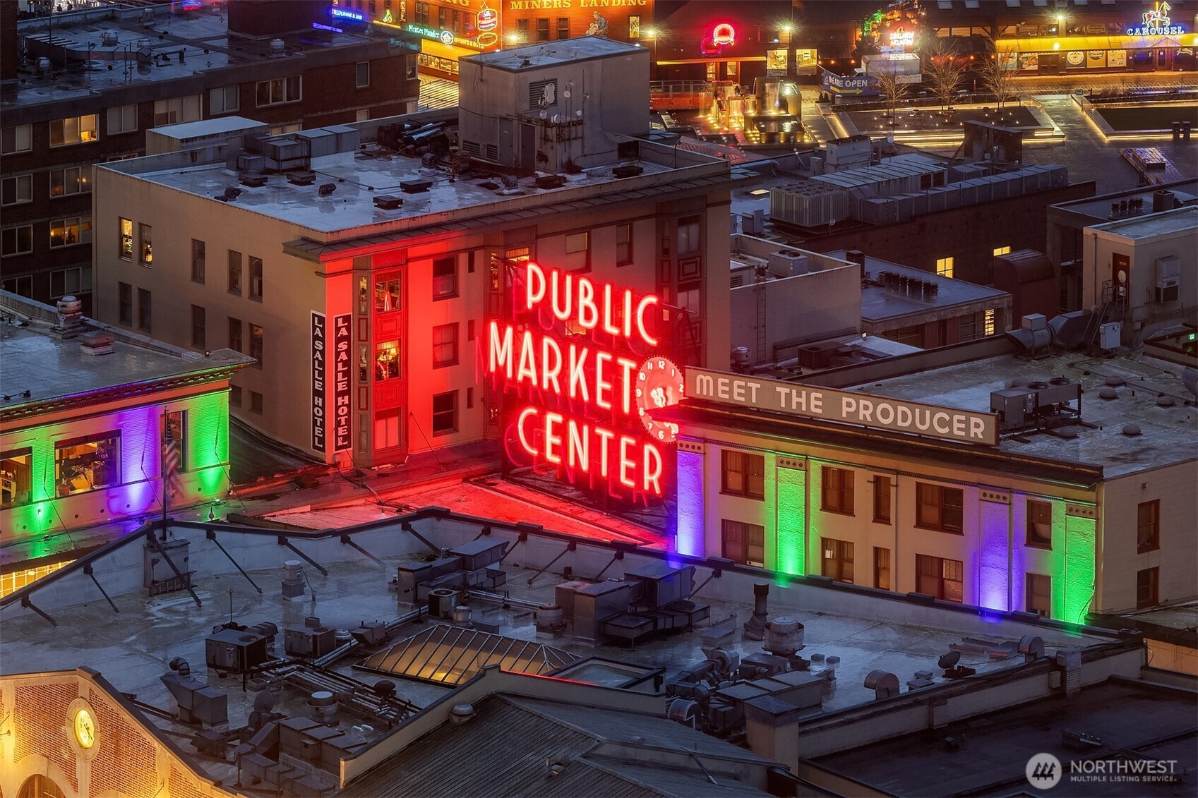 121 Stewart Street, Unit 1803 Seattle, WA 98101 - Photo 11 of 35 a city street filled with lots of traffic and tall building