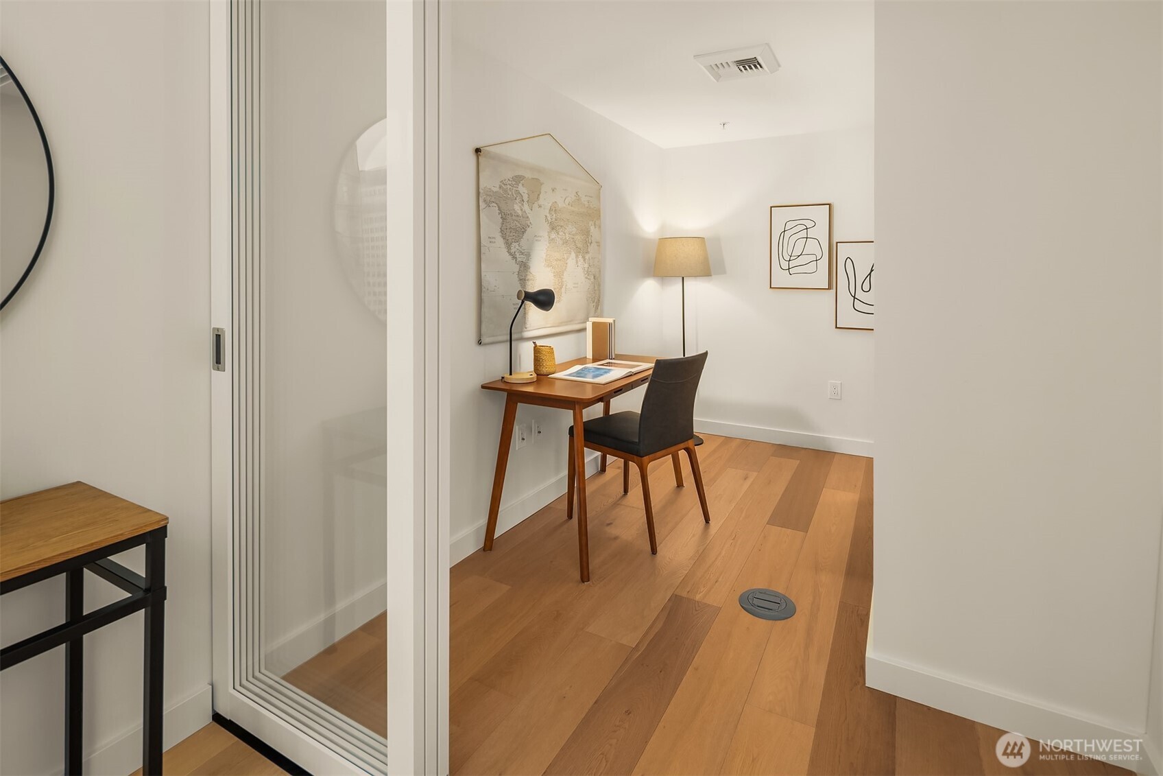 121 Stewart Street, Unit 1803 Seattle, WA 98101 - Photo 13 of 35 a view of a room with a table and chairs