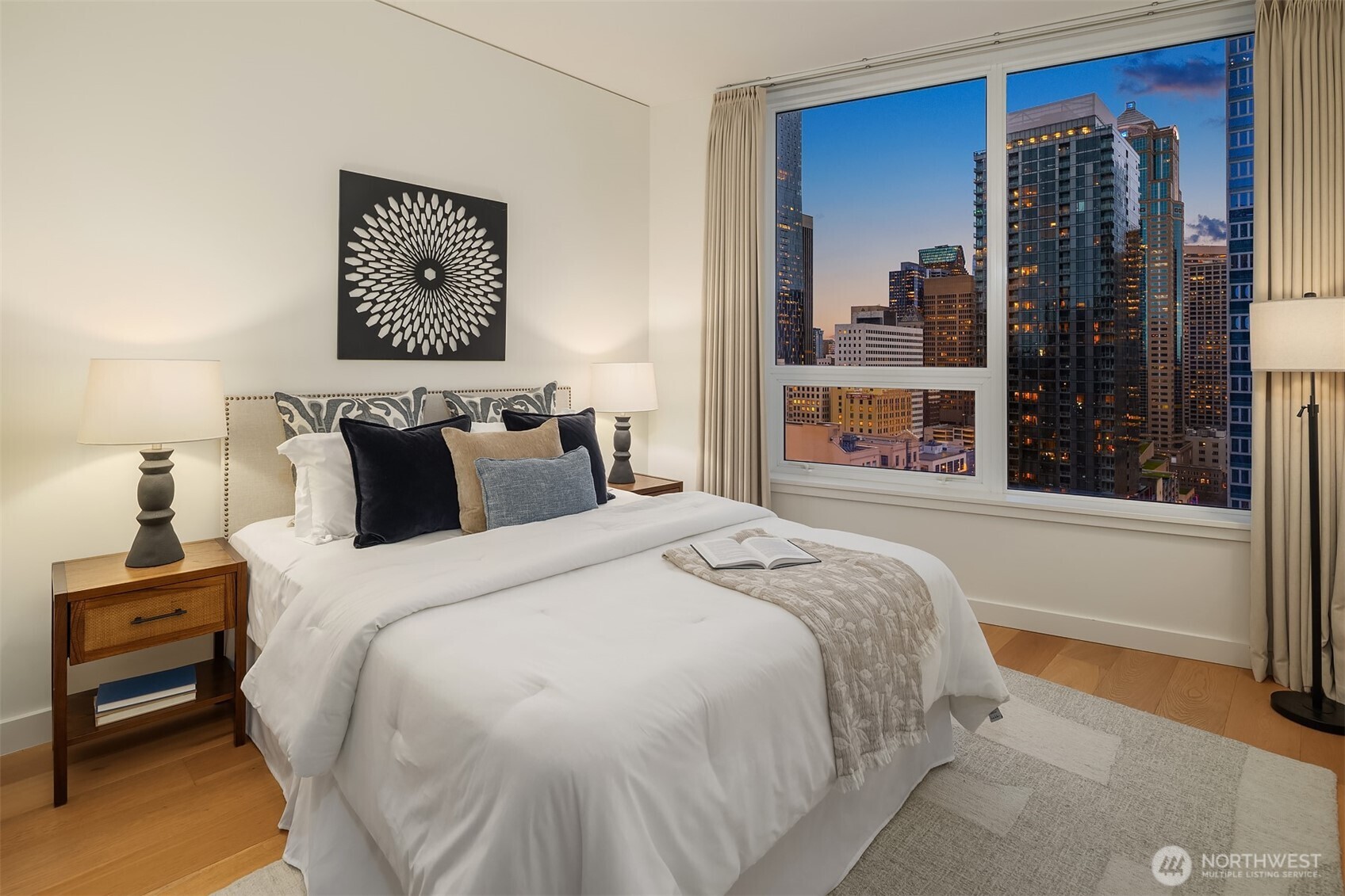 121 Stewart Street, Unit 1803 Seattle, WA 98101 - Photo 21 of 35 a bedroom with a bed and a large window