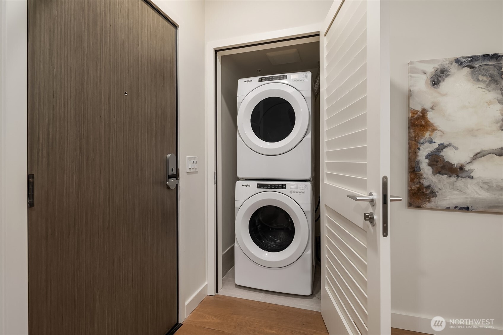 121 Stewart Street, Unit 1803 Seattle, WA 98101 - Photo 24 of 35 a utility room with dryer and washer