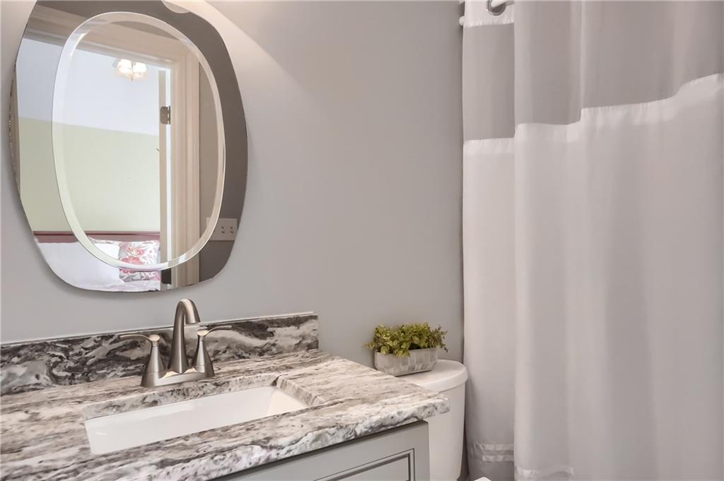 337 Parker Road Sarver, PA 16055 - Photo 18 of 25 Guest room bathroom with full walk in shower,and a vanity with a beautiful granite counter top.