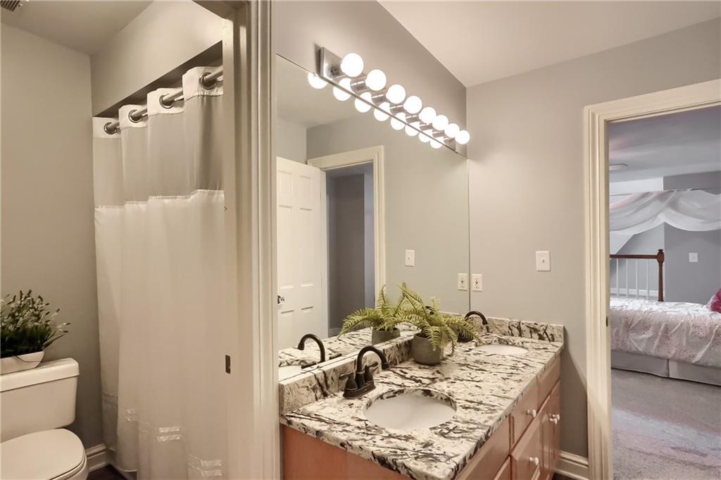 337 Parker Road Sarver, PA 16055 - Photo 20 of 25 Full Jack n Jill bathroom with a tub located between Bedroom 2 and 3. Lovely updated granite surface.