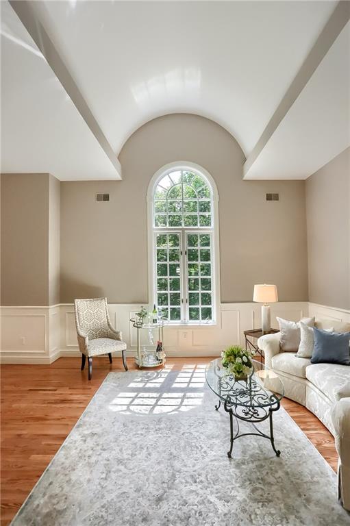 337 Parker Road Sarver, PA 16055 - Photo 5 of 25 Unbelievable domed ceiling in the living room that accents the palladium window. The room also has hardwood flooring and wainscoting.