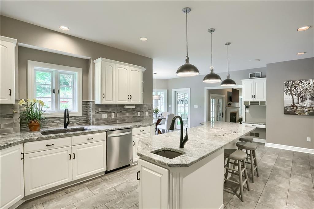 337 Parker Road Sarver, PA 16055 - Photo 7 of 25 Updated fully equipped kitchen. Large kitchen island with granite counter tops, Two sinks, stainless steel refrigerator and dishwasher.