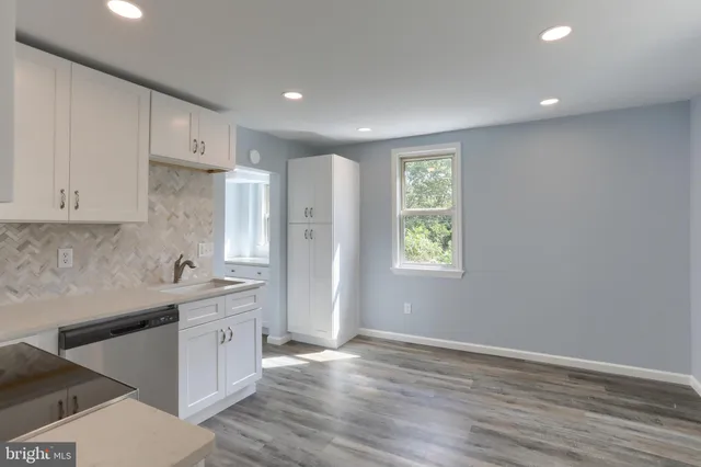 a bathroom with a sink toilet and tub