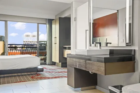 a living room with fireplace furniture and a large window