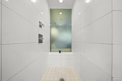 a bathroom with a sink and shower
