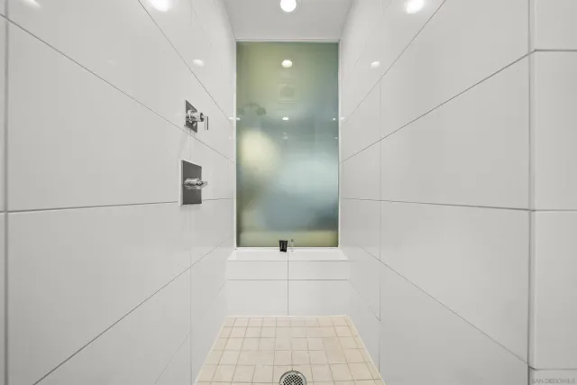 a bathroom with a sink and shower