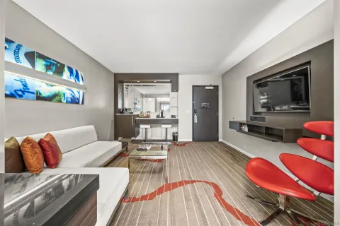 a living room with furniture and a flat screen tv