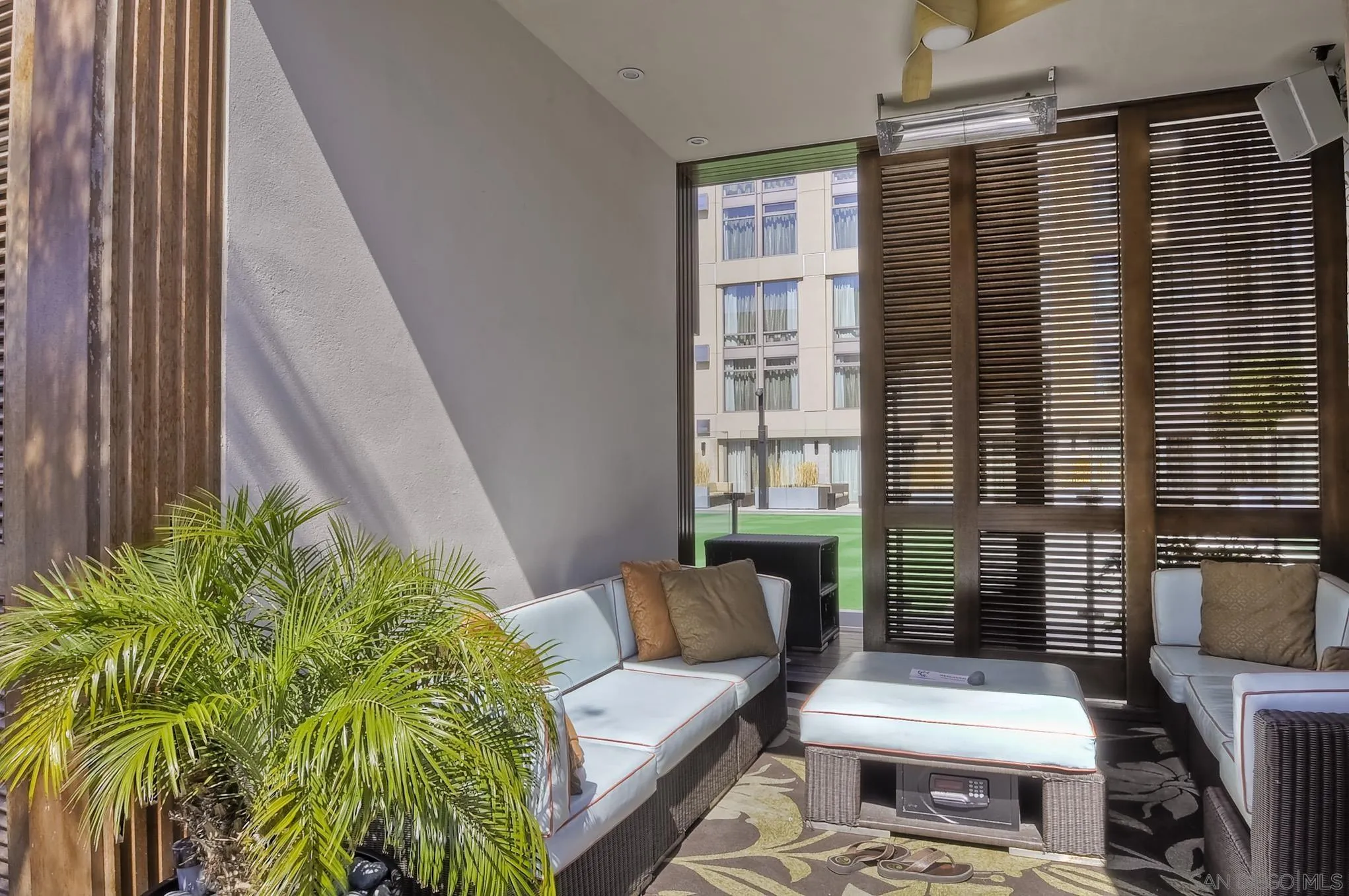 207 Fifth Avenue, Unit 940 San Diego, CA 92101 - Photo 22 of 31 a view of a patio with couches chairs and potted plants