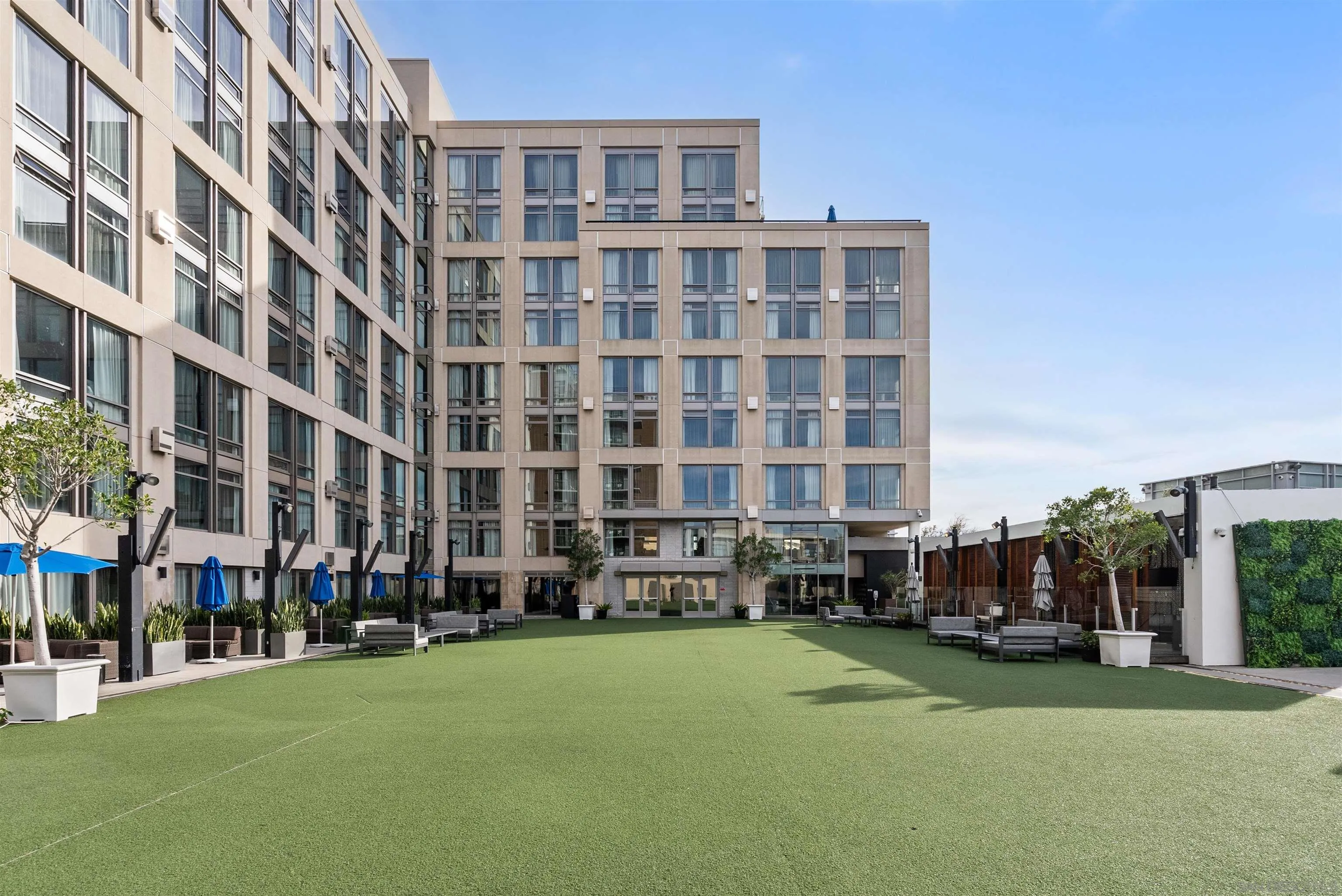 207 Fifth Avenue, Unit 940 San Diego, CA 92101 - Photo 27 of 31 a front view of a building with parked