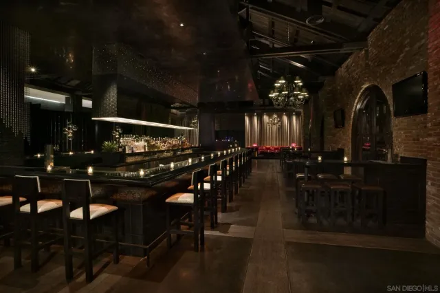 a dining room with furniture and a chandelier