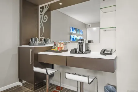 a dining room with table and chairs