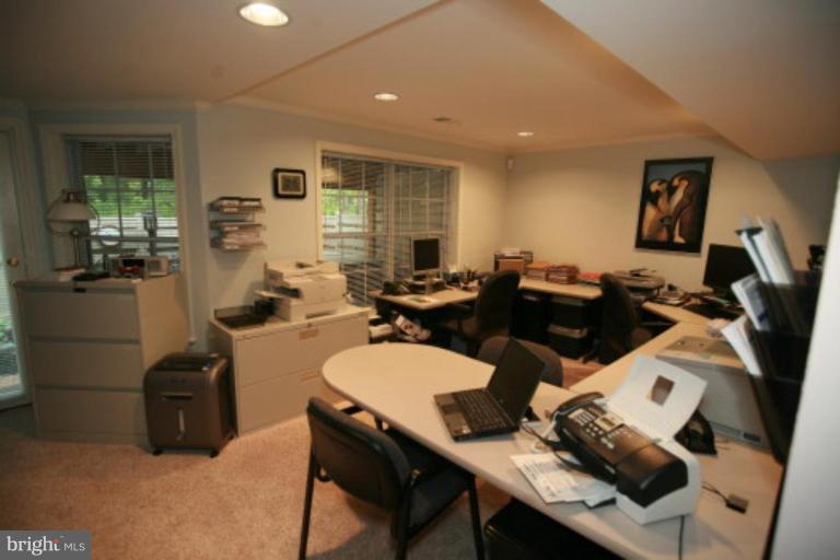 1506 Deer Point Way Reston, VA 20194 - Photo 30 of 30 a living room with furniture a flat screen tv and a window