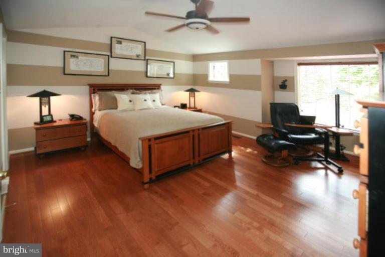 1506 Deer Point Way Reston, VA 20194 - Photo 6 of 30 a bedroom with a bed and window