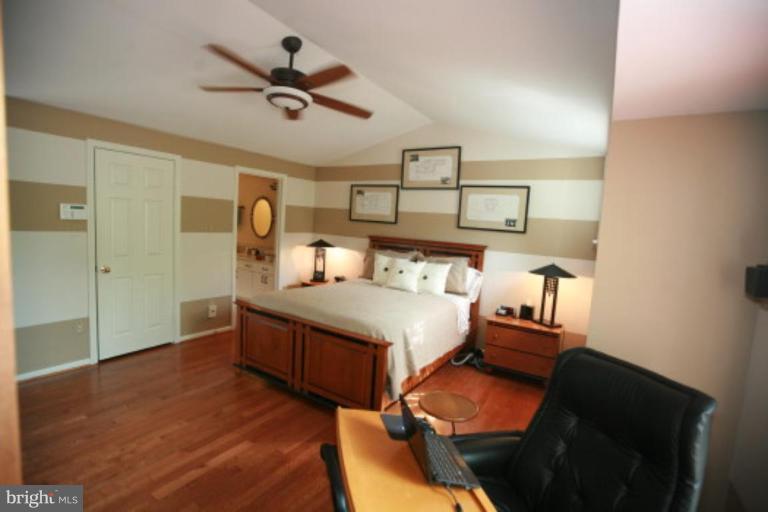 1506 Deer Point Way Reston, VA 20194 - Photo 7 of 30 a bedroom with a bed and window