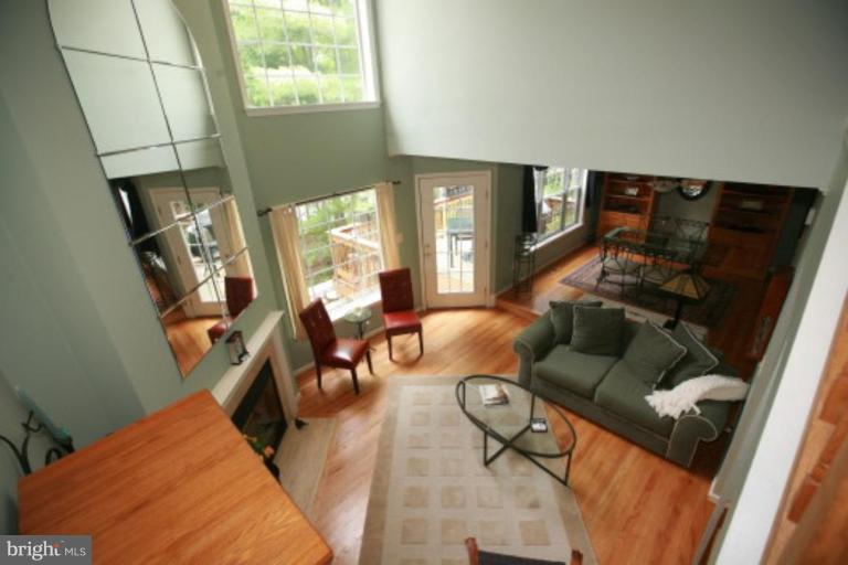1506 Deer Point Way Reston, VA 20194 - Photo 10 of 30 a living room with furniture and a flat screen tv