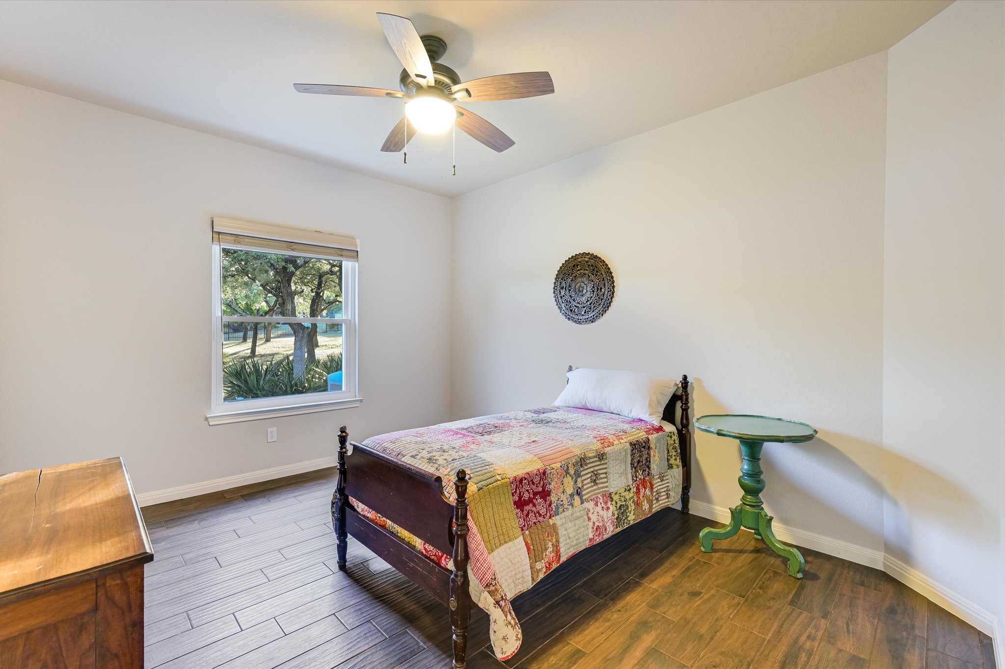786 Ranchers Club Lane Driftwood, TX 78619 - Photo 25 of 33 Bedroom featuring dark wood-style floors and a ceiling fan