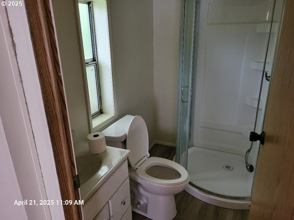 1050 North Cedar Point Road Coquille, OR 97423 - Photo 15 of 29 a bathroom with a sink a toilet and shower