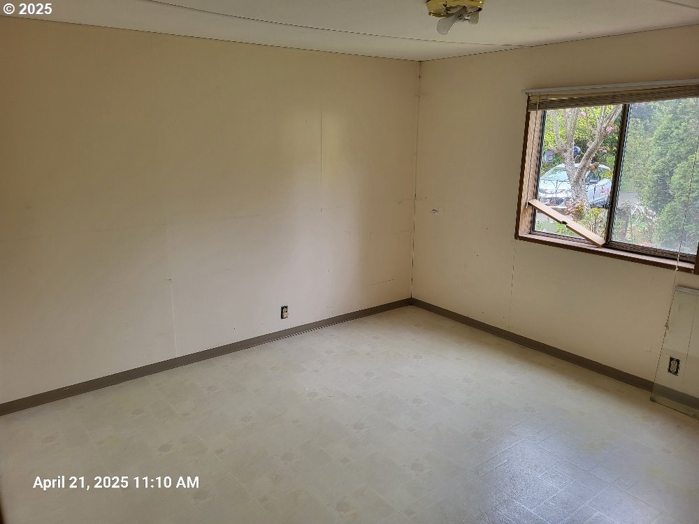 1050 North Cedar Point Road Coquille, OR 97423 - Photo 17 of 29 a view of a window in an empty room