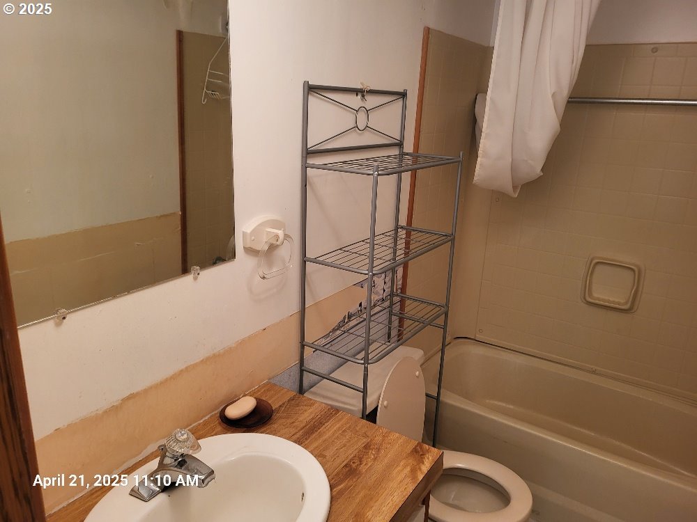 1050 North Cedar Point Road Coquille, OR 97423 - Photo 19 of 29 a bathroom with a sink and a shower