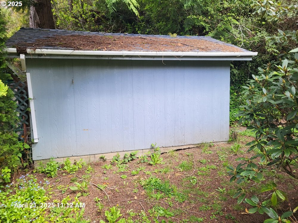 1050 North Cedar Point Road Coquille, OR 97423 - Photo 24 of 29 a side view of a house