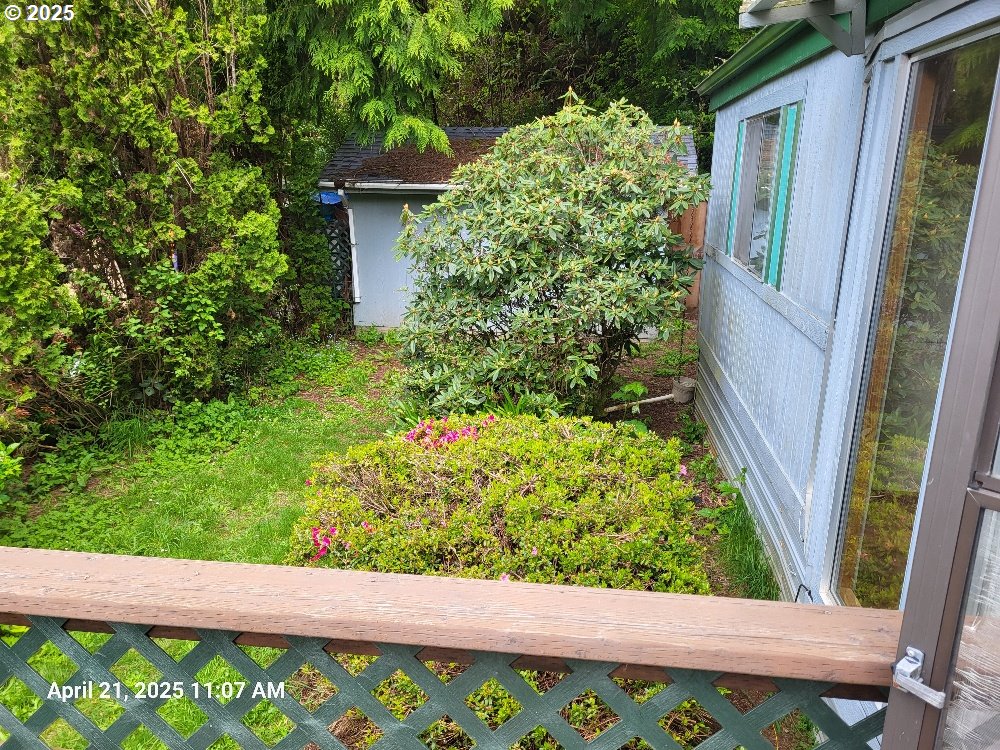 1050 North Cedar Point Road Coquille, OR 97423 - Photo 4 of 29 a view of a garden with a pathway