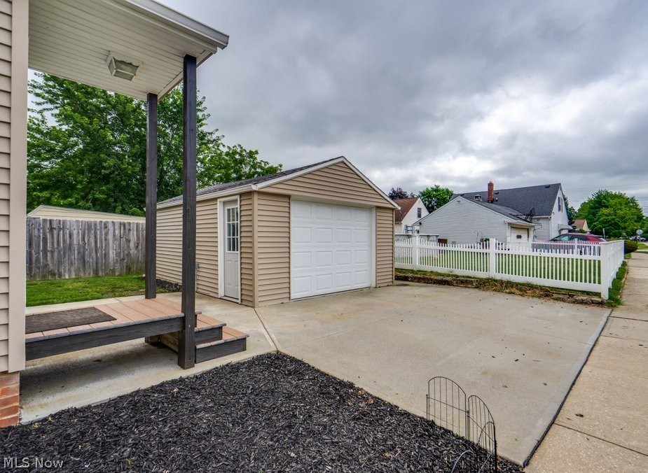 30000 Elgin Road Wickliffe, OH 44092 - Photo 28 of 30 Detached garage with horizontal vinyl siding and a white panel garage door