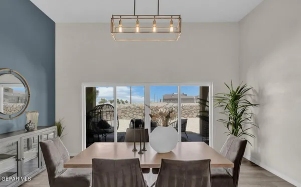 a view of a dining room with furniture window and flowerpot