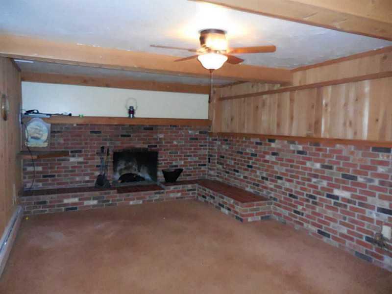 217 Kelley Road Industry, PA 15052 - Photo 13 of 25 Den/Family/Great Room. This is one side of the HUGE entertainment room. This includes a large with wood burning fireplace, bar that seats MANY that even has cozy stools, wet bar, storage.
