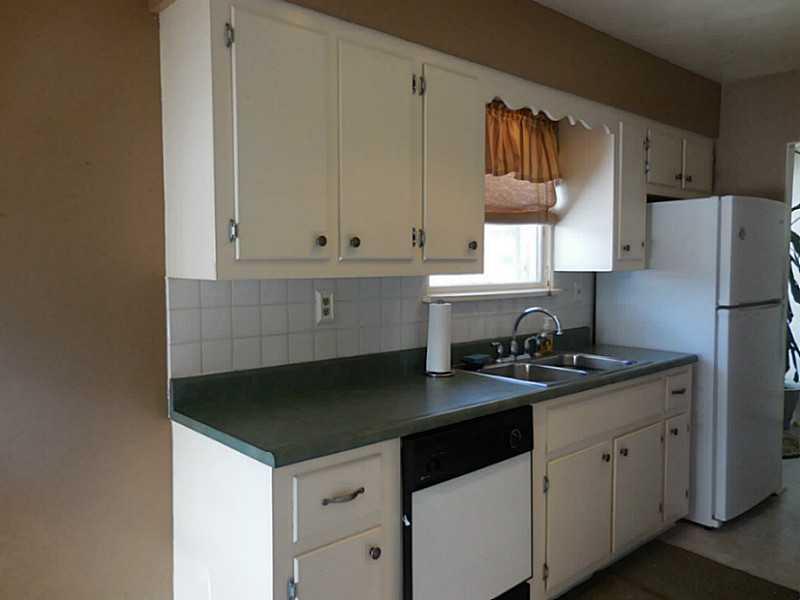 217 Kelley Road Industry, PA 15052 - Photo 4 of 25 Kitchen. What a cute kitchen! New paint, neutral, updated fixtures, gas stove, dishwasher and refrigerator stay!